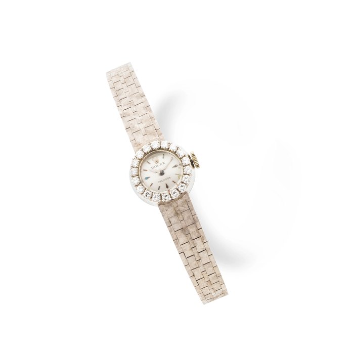 Rolex. Montre bracelet de dame en or blanc 18K (750) sertie de diamants mouvement mécanique Rolex. A lady's 18K white gold diamond set manual wind bracelet watch Precision, Ref: G383, circa 1964
