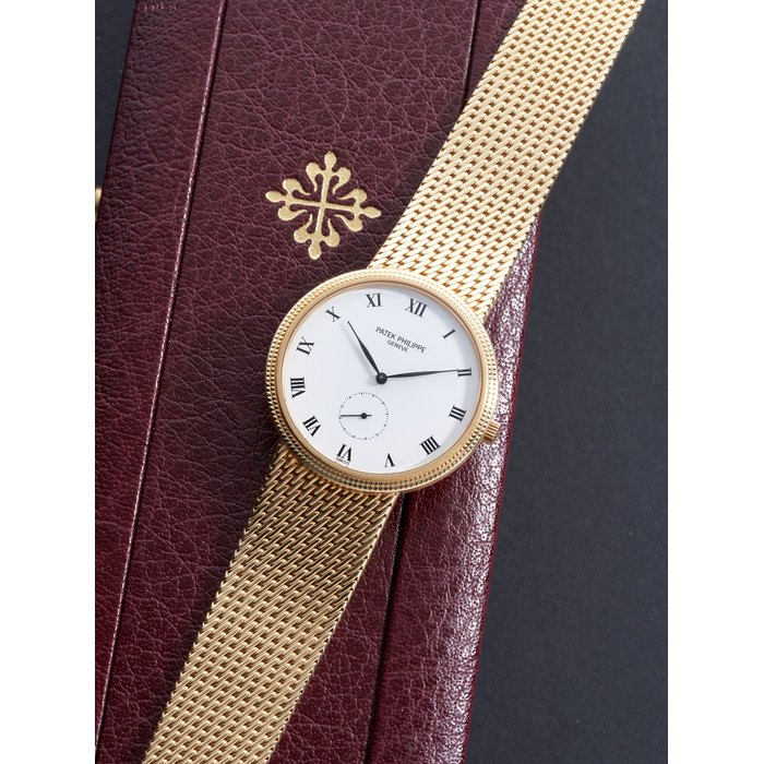 PATEK PHILIPPE | REF.3919/5, A YELLOW GOLD BRACELET WATCH, CIRCA 1997