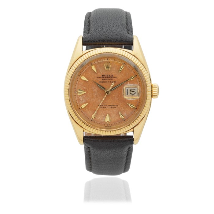 Rolex Rolex. An 18K gold automatic calendar wristwatch with roulette date wheel and retailed by Serpico Y Laino Datejust, Ref: 6605, Circa 1956, Price & Market Data