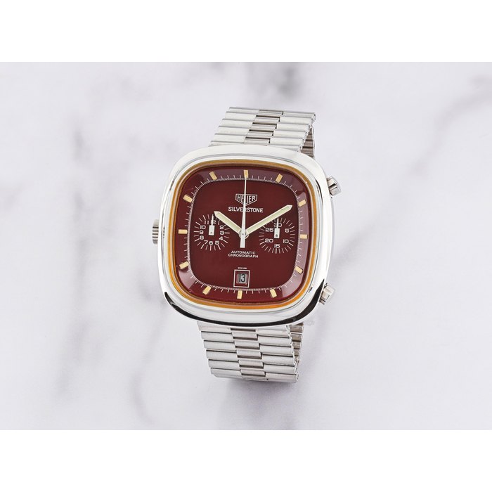 Heuer Heuer. Chronographe bracelet en acier de forme coussin avec date mouvement automatique Heuer. A stainless steel automatic calendar chronograph cushion form bracelet watch Silverstone, Ref: 110.313, Circa 1974, Price & Market Data