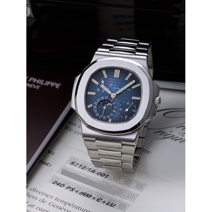 PATEK PHILIPPE | NAUTILUS - GENEVA SEAL, REF.5712/1A-001, A FINE STAINLESS STEEL BRACELET WATCH WITH POWER RESERVE INDICATION, MOON PHASES AND DATE, CIRCA 2006