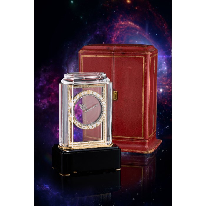 CARTIER | PENDULE MYSTERIEUSE "MODEL A", A SUPER RARE ART DECO ROCK CRYSTAL, YELLOW GOLD, ONYX, ENAMEL AND DIAMOND-SET MYSTERY CLOCK, CIRCA 1928