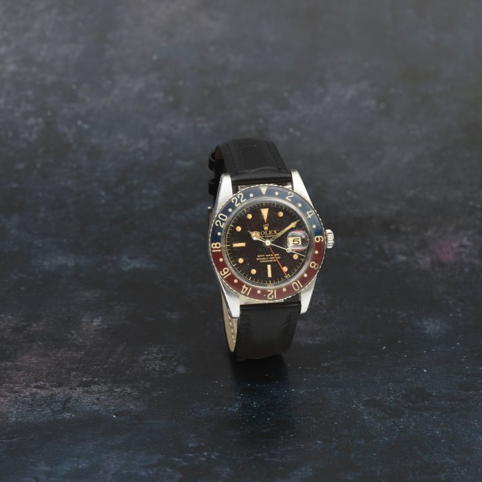 Rolex. A fine and rare stainless steel automatic calendar dual time wristwatch with bakelite bezel from the family of the original owner who flew in the RAF from 1944 and later as a commercial pilot until 1988 Ref. 6542