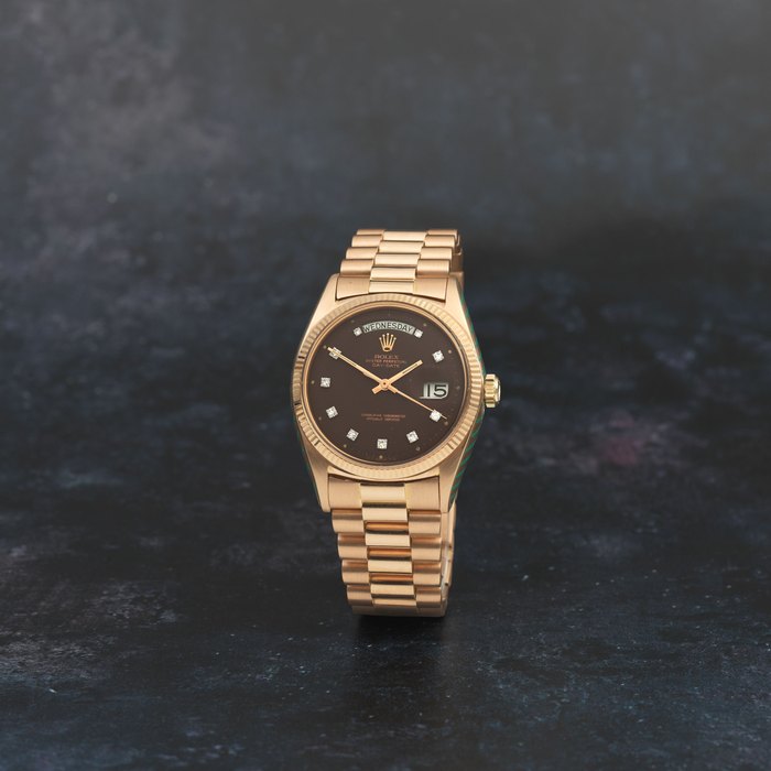 Rolex. An 18K rose gold automatic calendar bracelet watch with diamond set dial Day-Date, Ref: 1803, Circa 1959