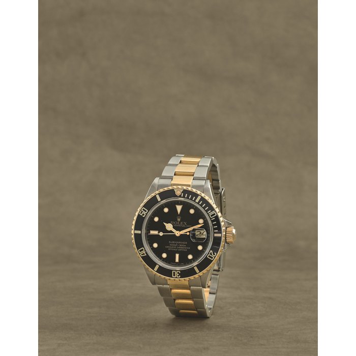 Rolex. Montre bracelet en or jaune 18K (750) et acier avec date mouvement automatique Rolex. A stainless steel and gold automatic calendar bracelet watch Submariner Date, Ref: 16803, Circa 1986