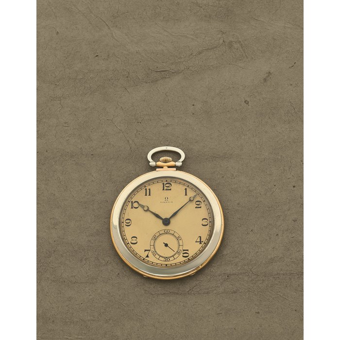 Breguet Omega. Montre de gousset à cadran ouvert en or jaune et blanc 18K (750) remontoir au pendant Omega. An 18K yellow and white gold keyless wind open face pocket watch Circa 1930