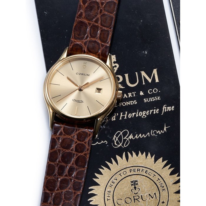 CORUM | A YELLOW GOLD WRISTWATCH WITH DATE, CIRCA 1994