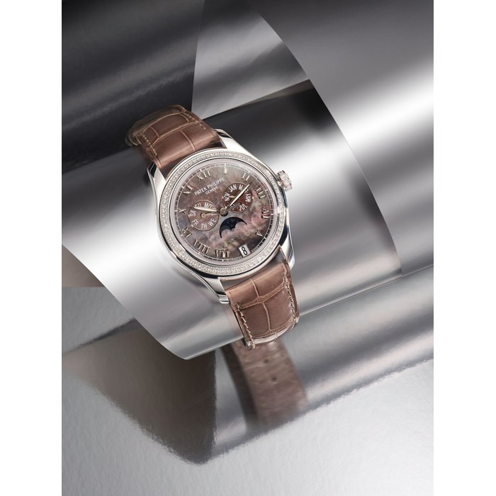 PATEK PHILIPPE | REF.4936G, A FINE LADY'S WHITE GOLD AND DIAMOND-SET ANNUAL CALENDAR WRISTWATCH WITH MOTHER-OF-PEARL DIAL AND MOON PHASE DISPLAY, CIRCA 2007
