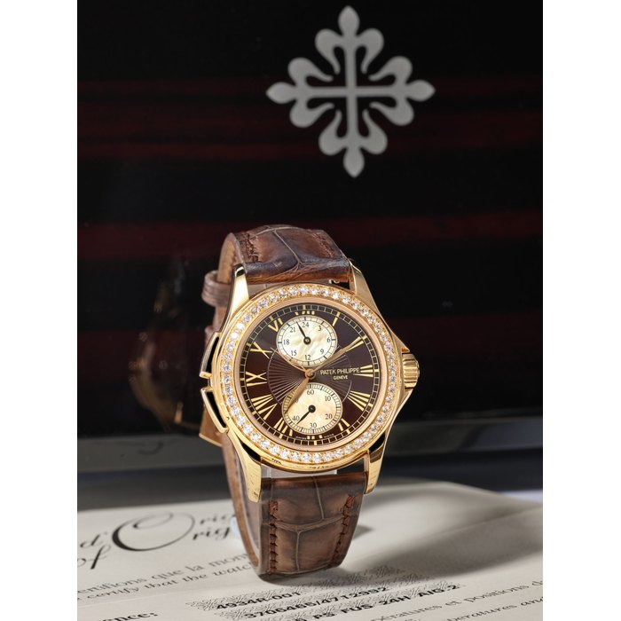 Patek Philippe PATEK PHILIPPE | CALATRAVA TRAVEL TIME, REF.4934R-001, A FINE LADY'S PINK GOLD AND DIAMOND-SET DUAL TIME WRISTWATCH WITH MOTHER-OF-PEARL DIAL, CIRCA 2009, Price & Market Data