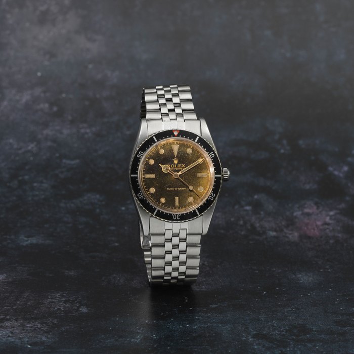 Rolex. A fine and rare stainless steel automatic bracelet watch with gilt dial Turn-o-Graph, Ref: 6202, Purchased 26th March 1964