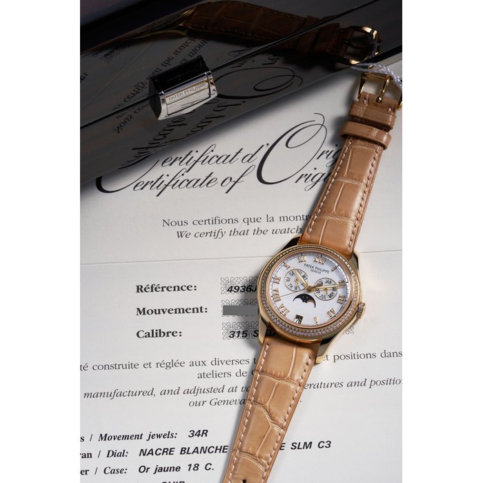 PATEK PHILIPPE | REF.4936J, A FINE YELLOW GOLD AND DIAMOND ANNUAL CALENDAR WRISTWATCH WITH MOTHER-OF-PEARL DIAL AND MOONPHASE, 2006