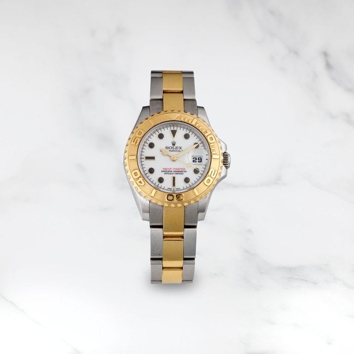 ROLEX. MONTRE BRACELET EN OR JAUNE 18K (750) ET ACIER AVEC DATE MOUVEMENT AUTOMATIQUE ROLEX. A STAINLESS STEEL AND 18K GOLD AUTOMATIC CALENDAR BRACELET WATCH Yacht-Master, Ref: 169623, Purchased 30 jan 2013