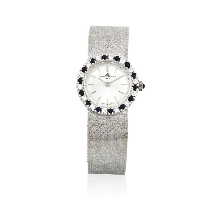 Baume & Mercier. A lady's 18K white gold manual wind diamond and sapphire set bracelet watch Circa 1980