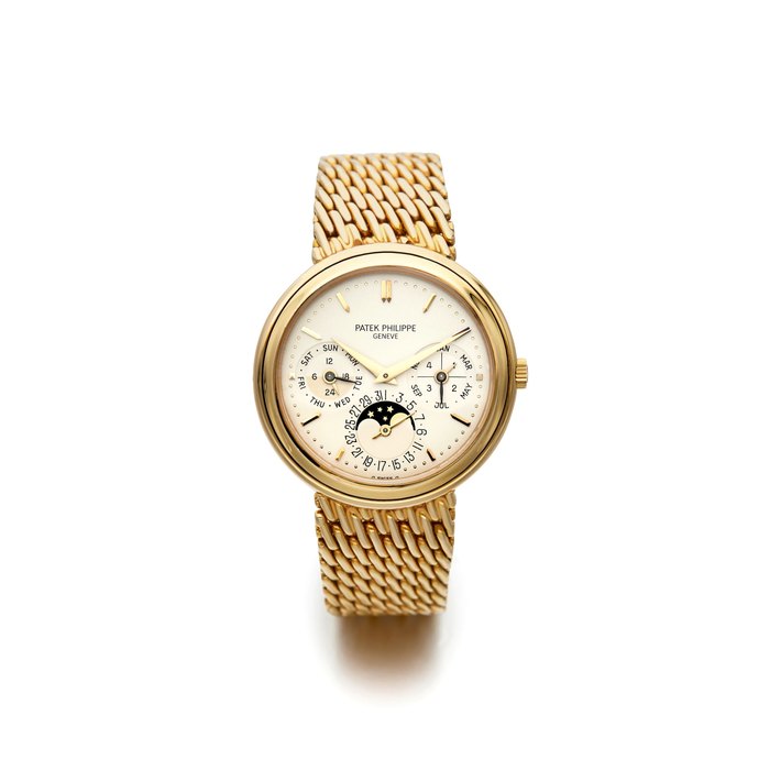PATEK PHILIPPE | REF. 3945/001, A RARE YELLOW GOLD PERPETUAL CALENDAR BRACELET WATCH WITH MOON PHASES, 1991