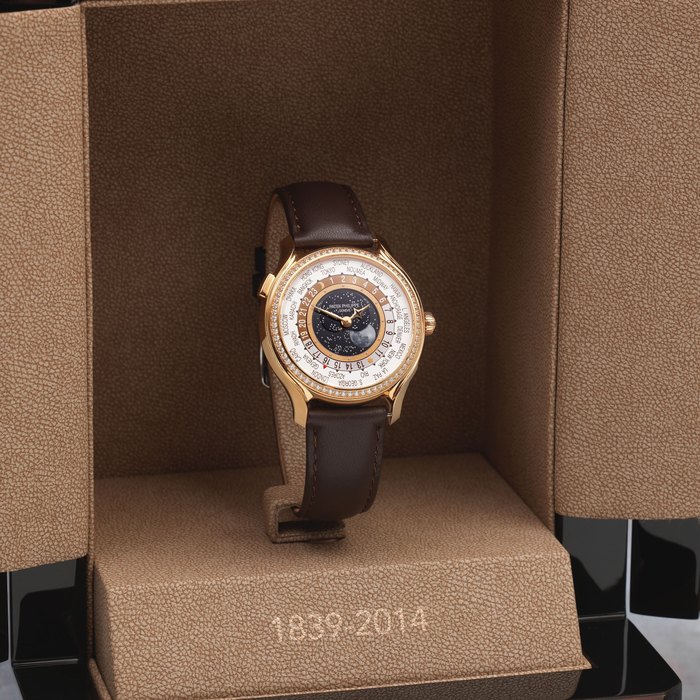 Patek Philippe. A fine and rare Limited Edition lady's 18K rose gold and diamond set World Time wristwatch with central moon phase World Time Moonphase, Ref: 7175R-001, Purchased 10th March 2015