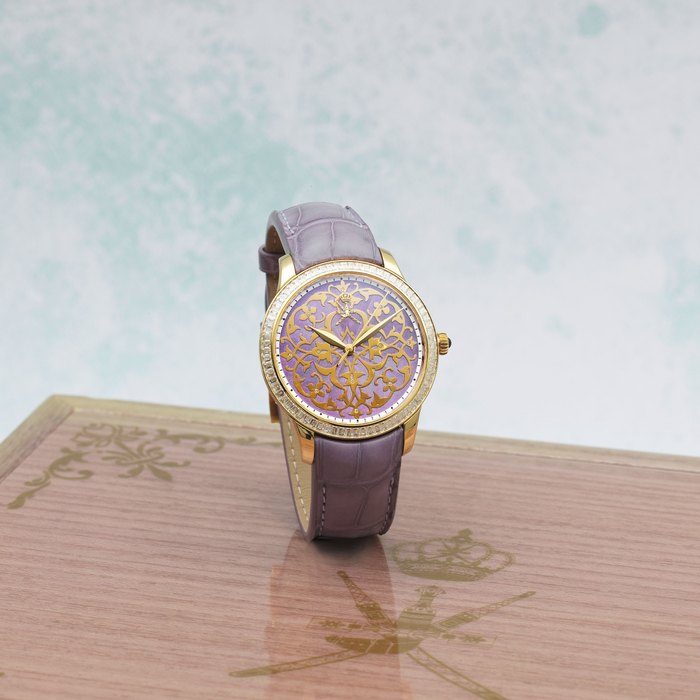 William & Son. An unusual 18K gold and diamond set automatic wristwatch with Khanjar emblem and enamel dial Circa 2017