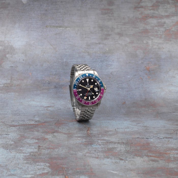 Rolex Rolex. A stainless steel automatic calendar bracelet watch with dual time zone GMT Master 'Fuchsia', Ref: 1675, Circa 1968 · 1675