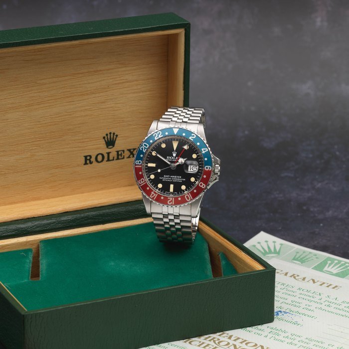 Rolex Rolex. A stainless steel automatic calendar bracelet watch with dual time zone GMT Master 'Pepsi', Ref: 1675, Purchased 14th February 1980 · 1675