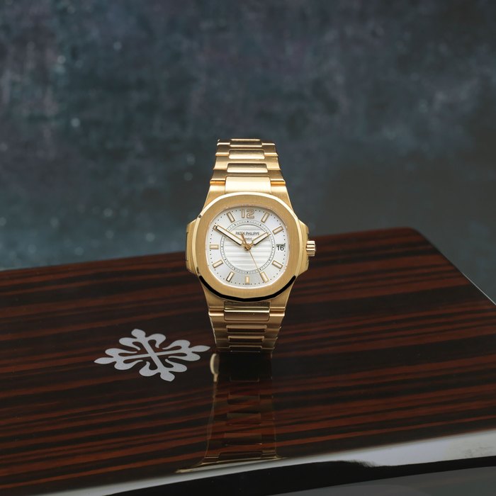 Patek Philippe. A fine 18K rose gold mid-size quartz calendar bracelet watch Nautilus, Ref: 7011/1R-001, Purchased 28th October 2016