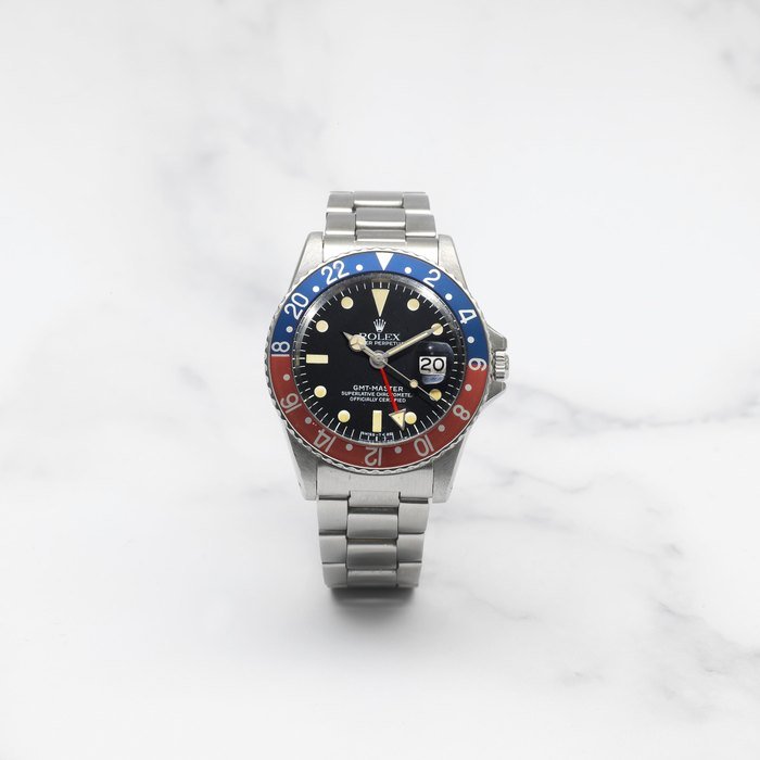Rolex ROLEX. MONTRE BRACELET EN ACIER AVEC DATE ET 2ND FUSEAU HORAIRE MOUVEMENT AUTOMATIQUE ROLEX. A STAINLESS STEEL AUTOMATIC CALENDAR BRACELET WATCH WITH DUAL TIME ZONE GMT Master 'Pepsi', Ref: 1675, 1966 · 1675
