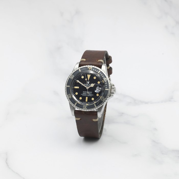 ROLEX. MONTRE BRACELET EN ACIER AVEC DATE MOUVEMENT AUTOMATIQUE ROLEX. A STAINLESS STEEL AUTOMATIC CALENDAR WRISTWATCH Submariner, Ref: 1680, Circa 1973
