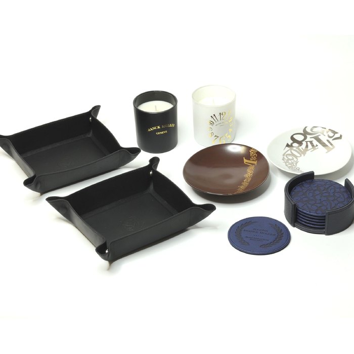 Franck Muller. A Set of Leather Cup Coaster, A Set of 2 Dishes, Two Leather Accessories Holders, and A Set of 2 Candles