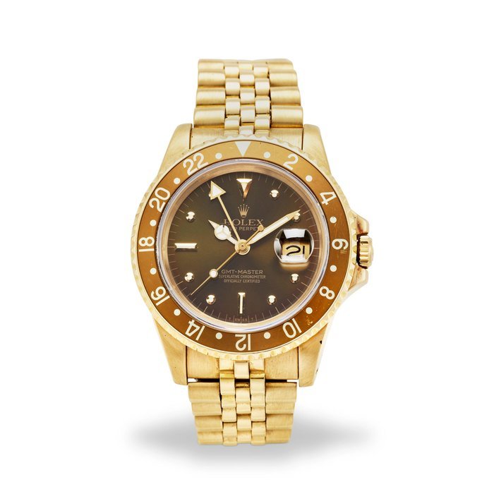 Rolex ROLEX. AN 18K YELLOW GOLD AUTOMATIC CALENDAR BRACELET WATCH WITH DUAL TIME ZONE GMT-Master, Ref: 16758, c.1984 · 16758