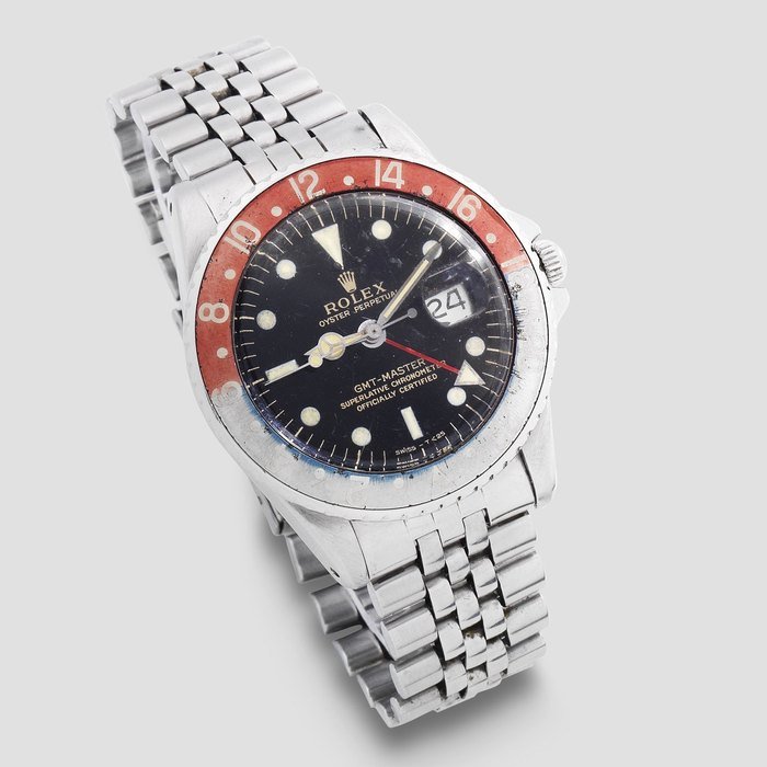 Rolex Rolex. A stainless steel automatic calendar bracelet watch with dual time zone and gilt dial GMT Master, Ref: 1675, Circa 1964 · 1675