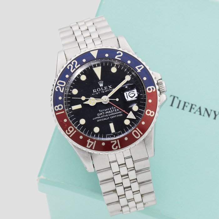 Tiffany & Co Rolex. A rare stainless steel automatic calendar bracelet watch with dual time zone retailed by Tiffany & Co GMT Master, Ref: 1675, Circa 1970 · 1675