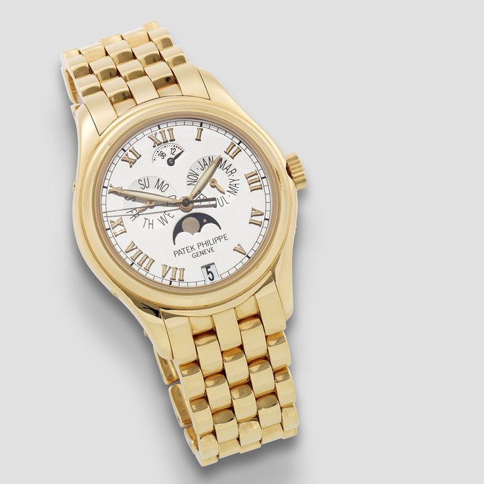 Patek Philippe. A fine 18K gold automatic annual calendar bracelet watch with moon phase Ref: 5036/1R-001, Circa 2000