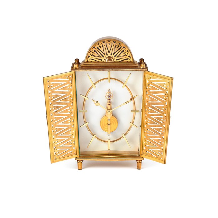 Jaeger-LeCoultre Swiss, In the manner of Jaeger LeCoultre. A Gilt Metal Decorative Mantel Timepiece