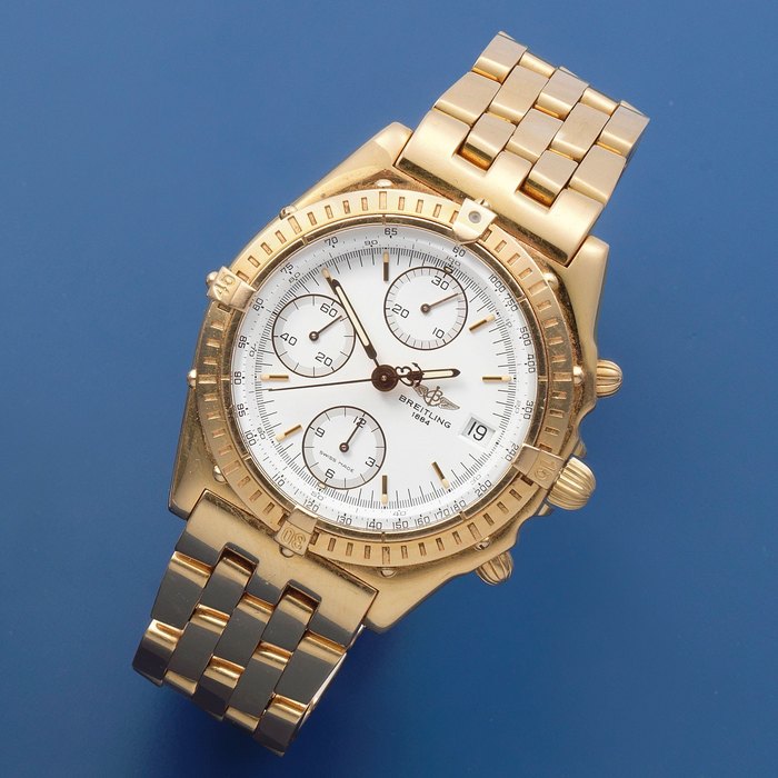 Breitling. An 18K gold automatic calendar chronograph bracelet watch Chronomat, Ref: H13048, Circa 2000