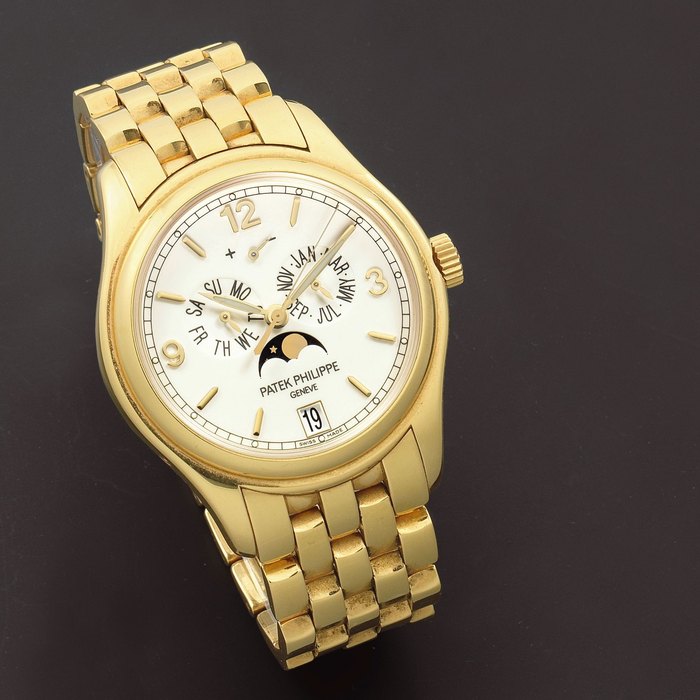 Patek Philippe. A Fine 18K gold automatic annual calendar bracelet watch with moon phase Ref: 5146, Sold 18th July 2006