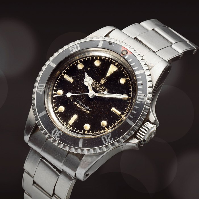 Rolex. A rare stainless steel automatic bracelet watch with gilt dial and square crown guards Submariner, Ref: 5512, Circa 1959