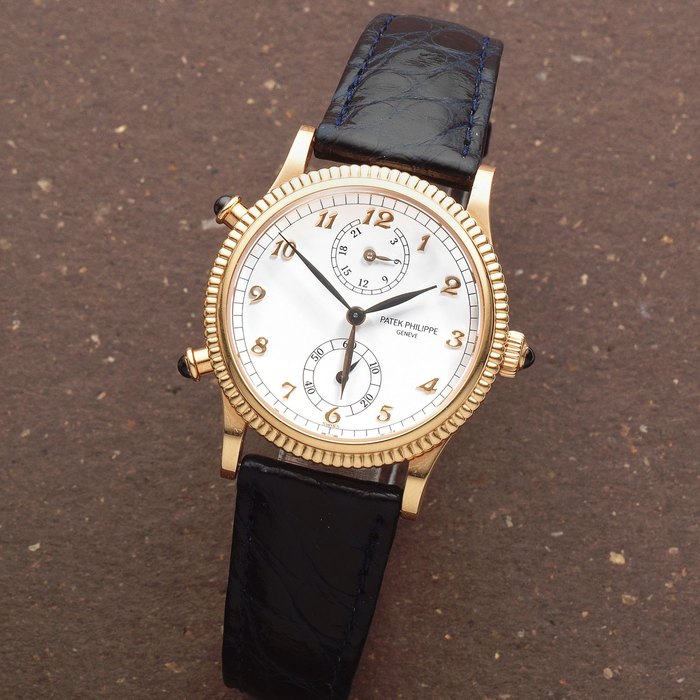 Patek Philippe. A Fine lady's 18k rose gold manual wind wristwatch with dual time zone Travel Time, Ref: 4864R 001, Circa 2000
