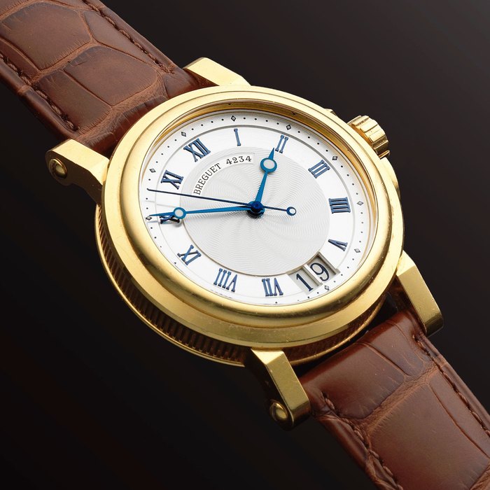 Breguet. An 18K gold automatic calendar wristwatch Marine, Ref: 5817, Sold April 11th, 2008