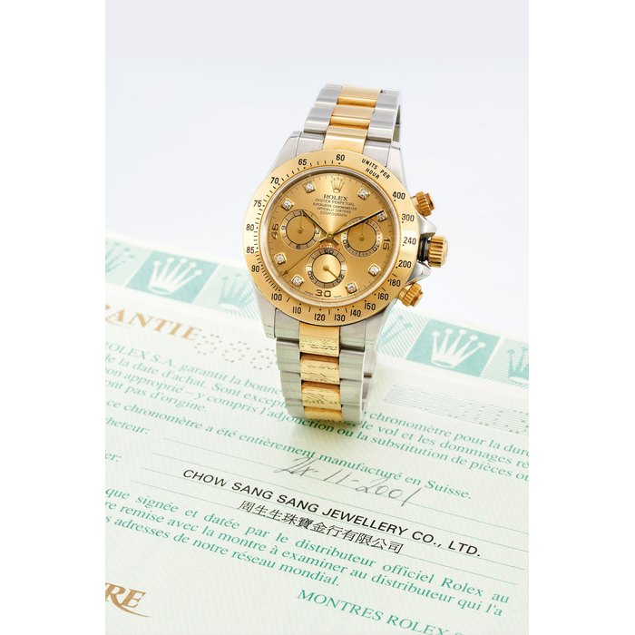 Rolex, A 18K Gold and Steel Oyster Perpetual Cosmograph Daytona Wristwatch, No. 116523-P530349, with ceritificate