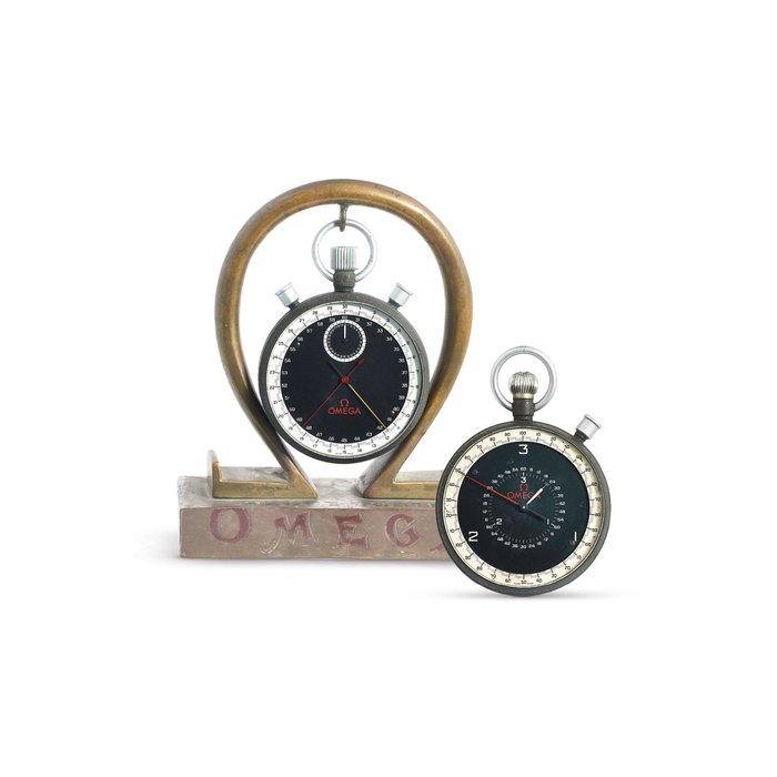Omega Two Omega Watches. A Stainless Steel Split Second Calendar Stop Watch, A Stainless Steel Open Face 1/10th Second Stop Watch, With a stand