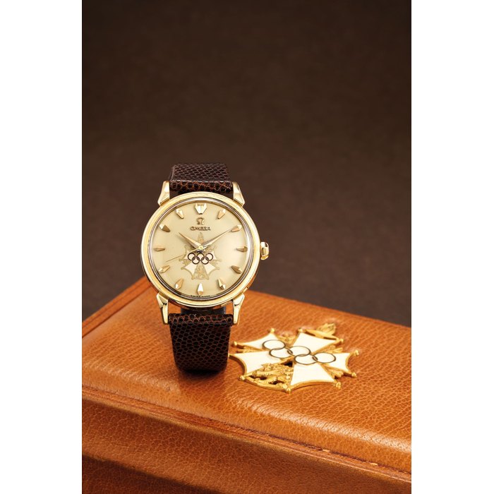 Omega. A Yellow Gold Wristwatch Produced to Commemorate the 1956 Olympic Games, Held in Melbourne, Australia, with a special leather box and warranty card