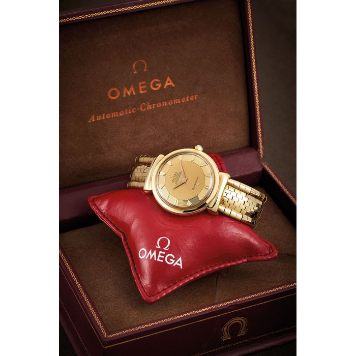 Omega Omega. A Yellow Gold Bracelet Watch with Hooded Lugs, With box, Price & Market Data