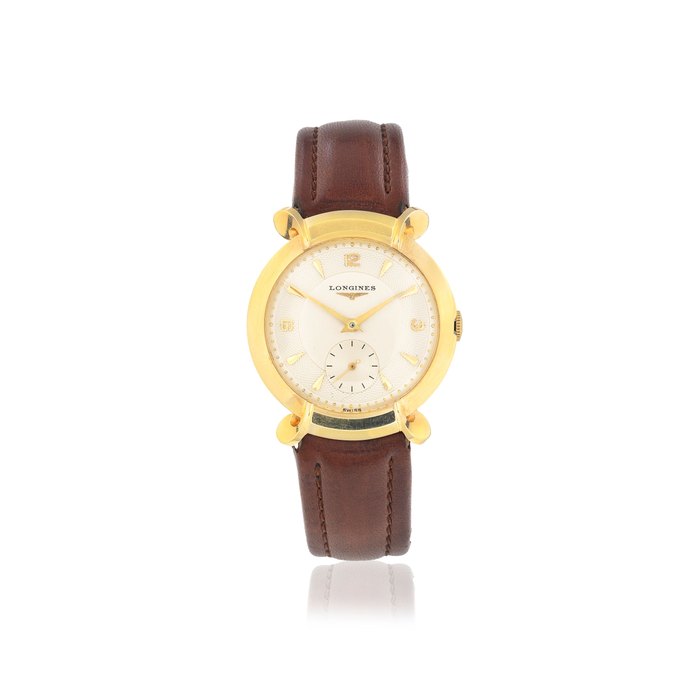 Longines. A 14K gold manual wind wristwatch with unusual horned lugs Circa 1950