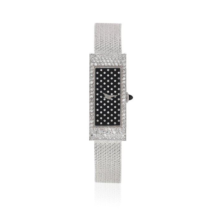 Corum. A lady's 18K white gold and diamond set manual wind bracelet watch Ref: 17135B47, Circa 1980
