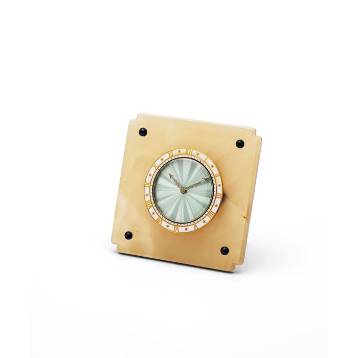 Cartier. An early 20th century agate desk timepiece with sapphire and enamel decoration Circa 1920