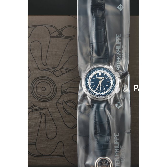 Patek Philippe, A Fine and Rare White Gold World-Time Chronograph Automatic Wristwatch, Single-Sealed, Ref. 5930/G-001 Mvt 5919765 Case 6164429 w b+c (in seal)