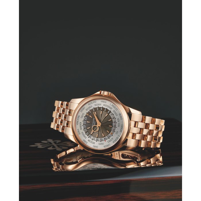Patek Philippe, A Pink Gold Automatic World Time Bracelet Watch, Ref. 5130/1R Mvt No. 5648892 Case No. 4564294 with box and certificate