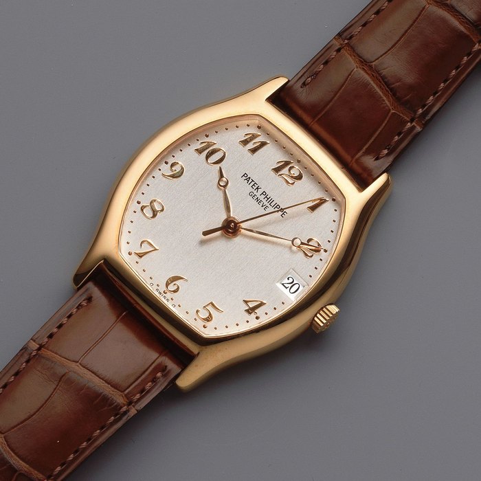 Patek Philippe. An 18K rose gold automatic calendar tonneau form wristwatch Gondolo, Ref: 5030R, Circa 1999