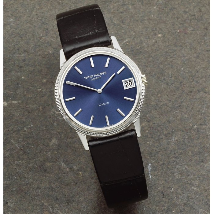 Patek Philippe. An 18K white gold automatic calendar wristwatch retailed by Gübelin Calatrava, Ref: 3602, Circa 2000
