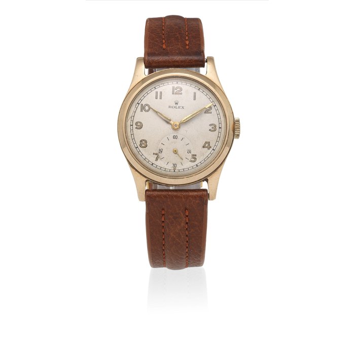 Rolex. A 9K gold manual wind wristwatch Circa 1955