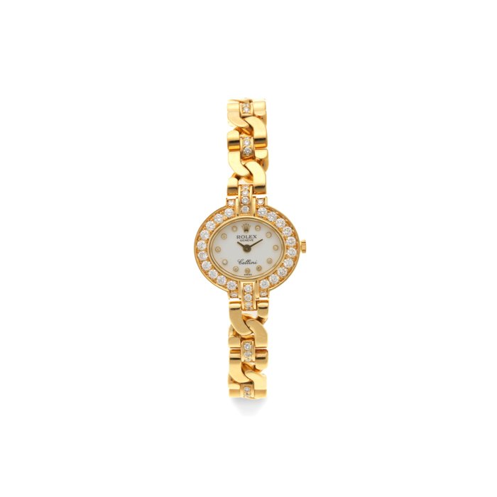 Rolex. A lady's 18K gold and diamond set manual wind bracelet watch Cellini, Ref: 2435, Circa 1995