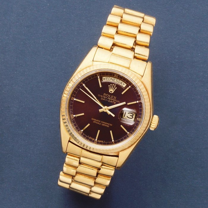 Rolex. An 18K gold automatic calendar bracelet watch with tropical dial Day-Date, Ref: 18038, Circa 1978